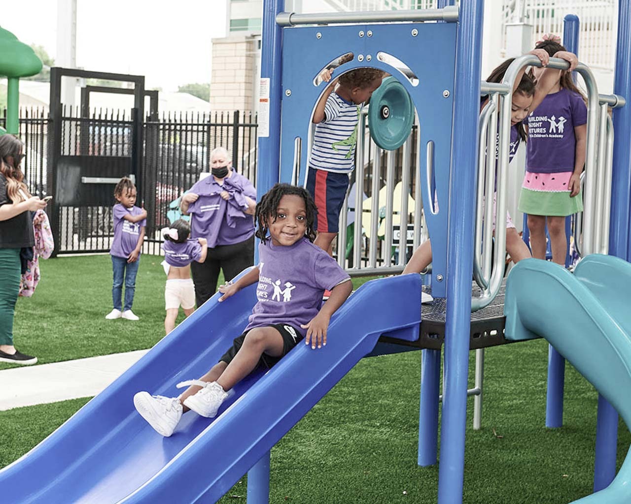 ymca-houston-locations-center-amenities-for-children’s-academy (1) young girl playing on a playground