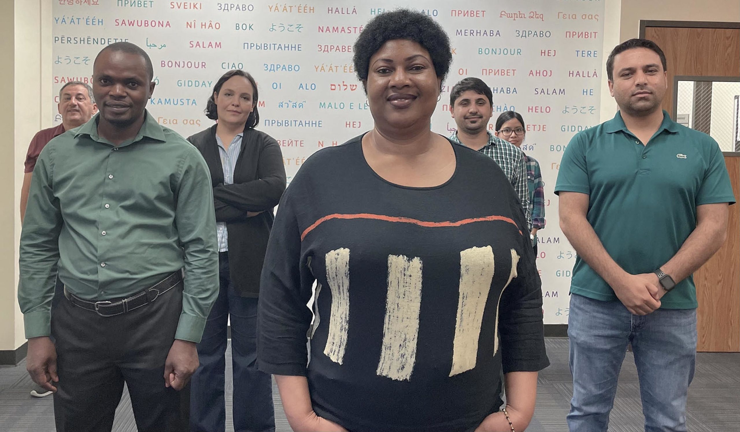 group of diverse people standing and looking at the camera