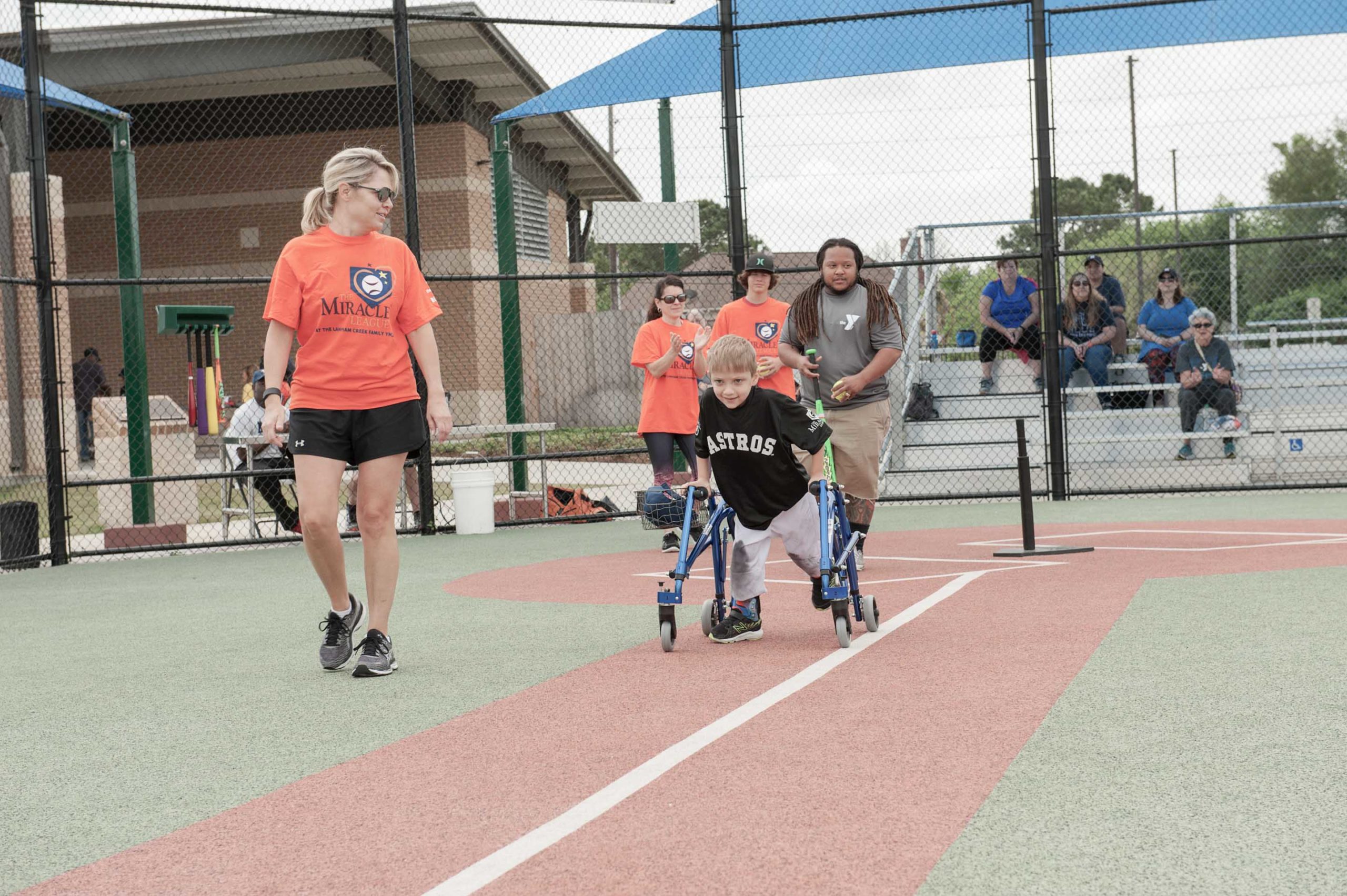 young disabled child playing baseball