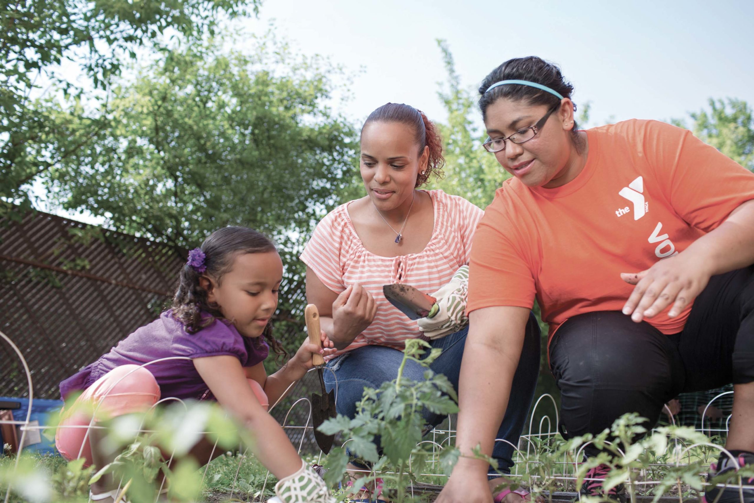 YMCA staff working on garden