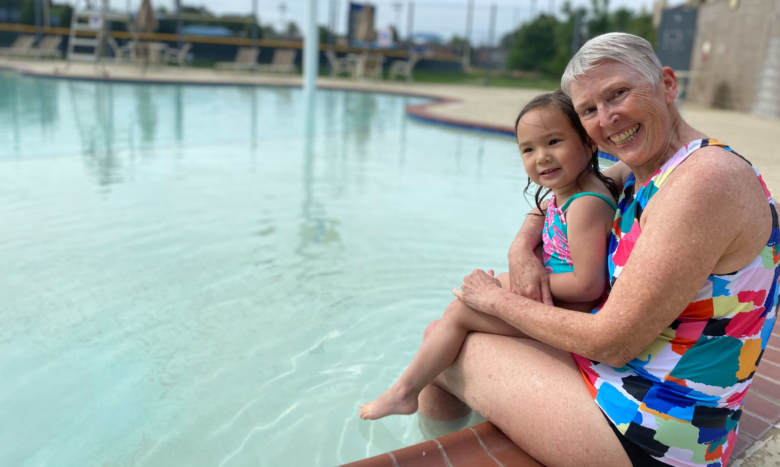 senior woman with child at pool