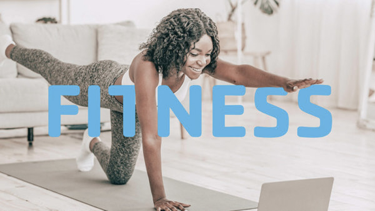 Attractive black woman making morning exercise at home