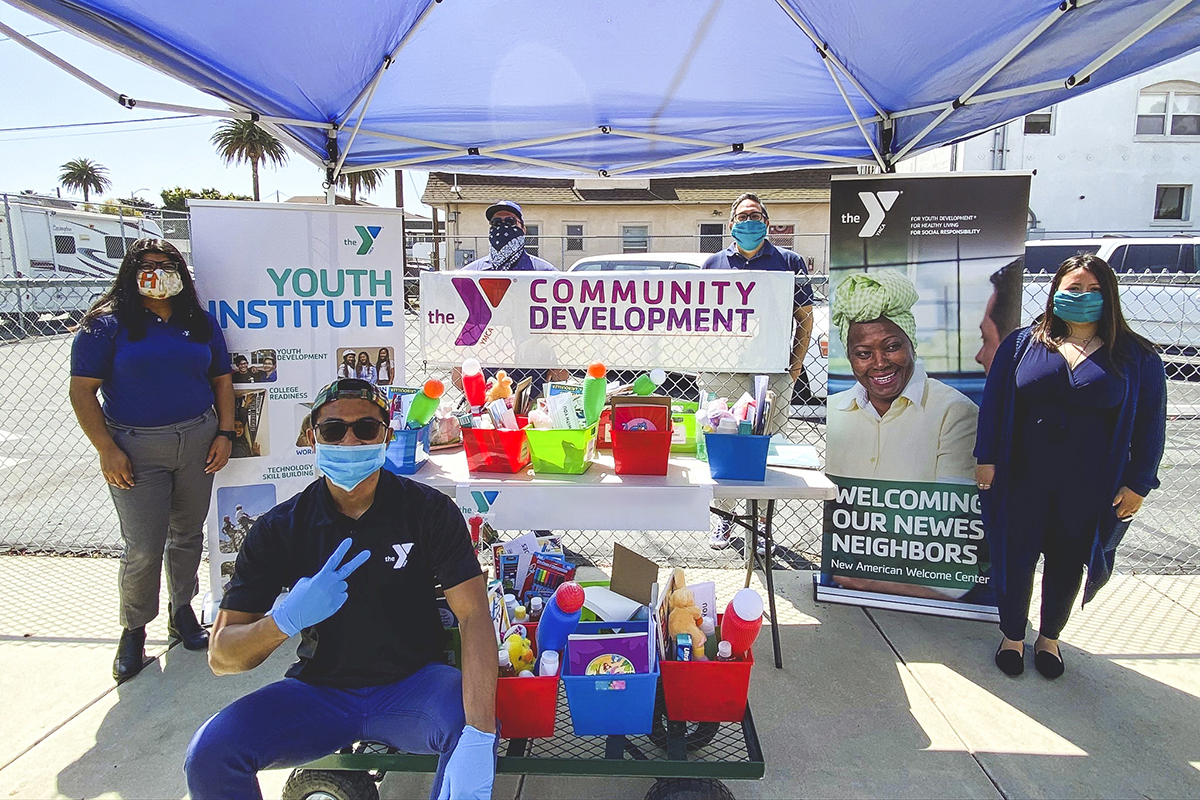 The YMCA Community Development booth with volunteers