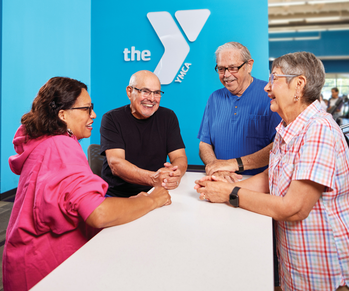 Group of elderly people having a chat in the YMCA facility