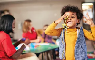 Young kids doing fun activities inside a classroom
