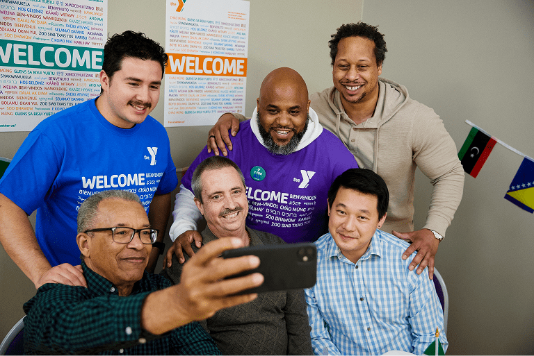 Two people exercising in a gym using TRX straps (1)