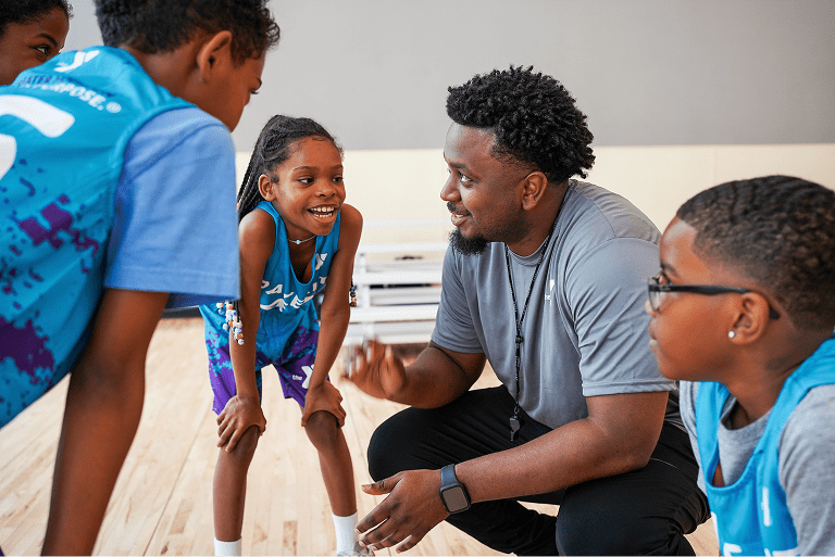 Two people exercising in a gym using TRX straps (2)