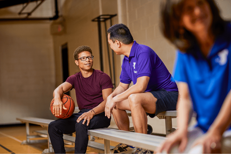 Two people exercising in a gym using TRX straps (3)